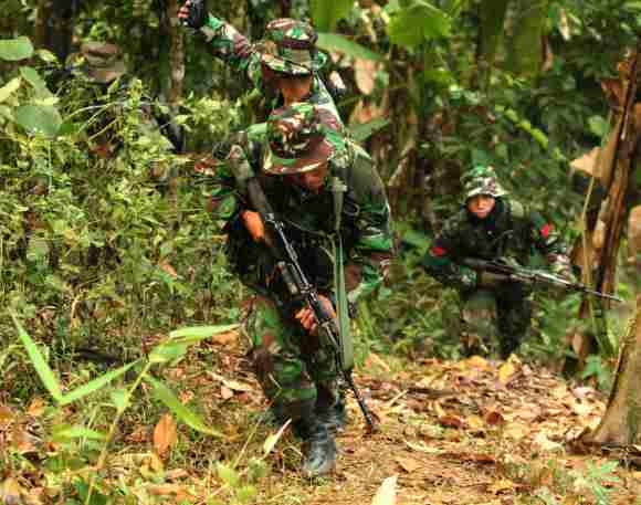 Soldiers during an insurgency and jungle warfare drill of Indian and Indonesian armies
