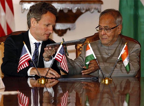 A file photo of US Secretary of Treasury Timothy Geithner and Finance Minister Pranab Mukherjee during the signing of the 2011 US-India Economic and Financial agreement