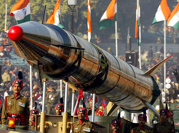 Soldiers stand beside the Agni missile during the Republic Day parade in New Delhi