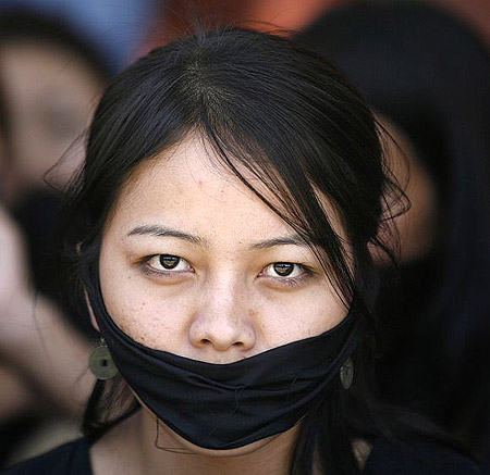 A Manipuri student participates in a protest