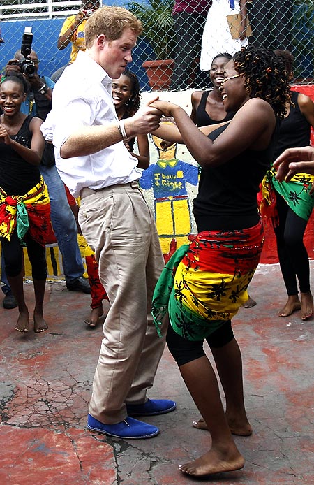 Britain's Prince Harry dances at a youth community center in Kingston, Jamaica