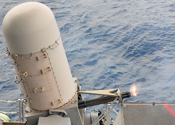 The combat systems department aboard the aircraft carrier USS Enterprise test-fires the close-in weapons system during a pre-action aim calibration fire