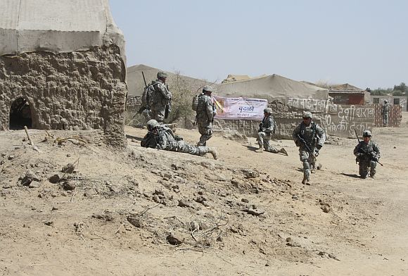 A cordon being set up around the abandoned village