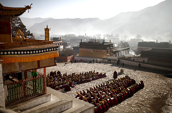 Monks gather to pray at the Labrang monastery in Xiahe county, Gansu Province