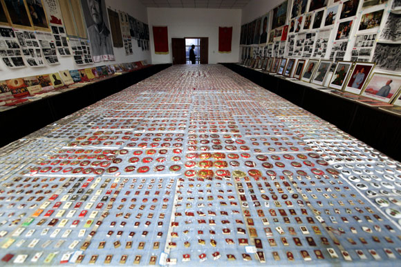 Badges of late Chinese leader Mao Zedong are displayed at a museum