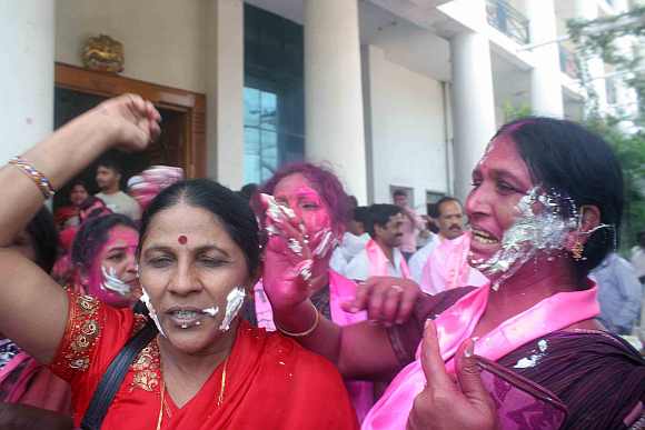 TRS supporters celebrate after the by-poll win