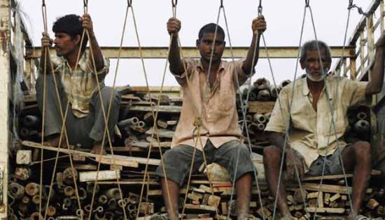 File photo of migrant workers from Bihar in a truck in Mumbai