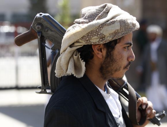 A tribal militia man carries an AK-47 in Waziristan