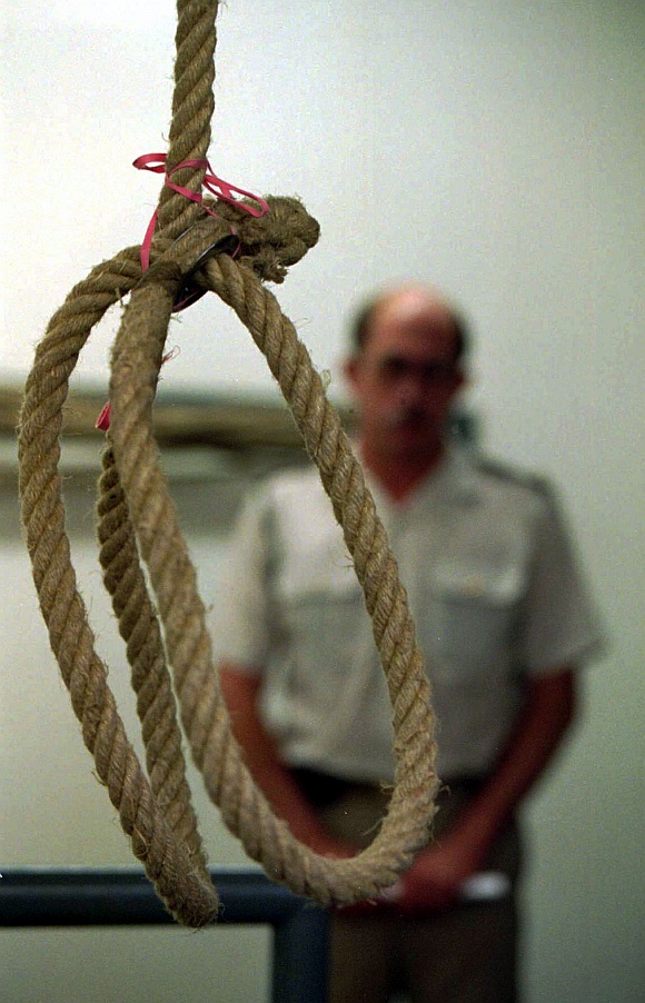 A prison guard looks over the hangman's noose at Pretoria's maximum security prison gallows