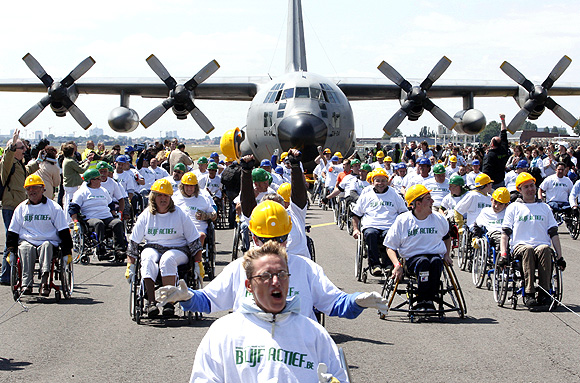 Heaviest plane pulled by people in wheelchairs
