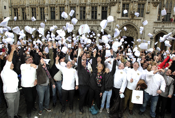 Largest gathering of people throwing chefs hats