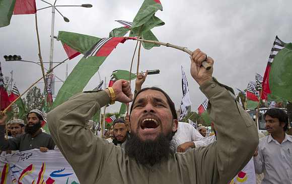 A supporter of religious political party Sunni Tehreek shouts anti-American slogans during a demonstration in Islamabad