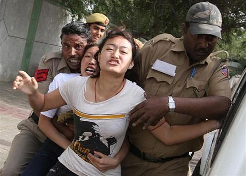 Tibetan exiles are detained by police during a protest against the visit of Chinese President Hu Jintao to India, outside the hotel where Hu is staying, in New Delhi