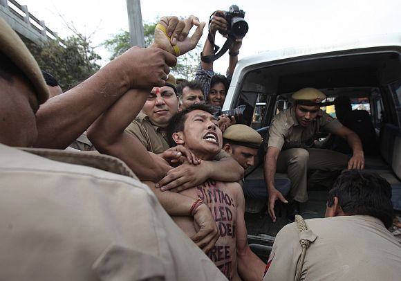 A young Tibetan is detained by Delhi police during a protest outside the hotel where then Chinese president Hu Jintao was staying in March 2012. Photograph: Adnan Abidi/Reuters