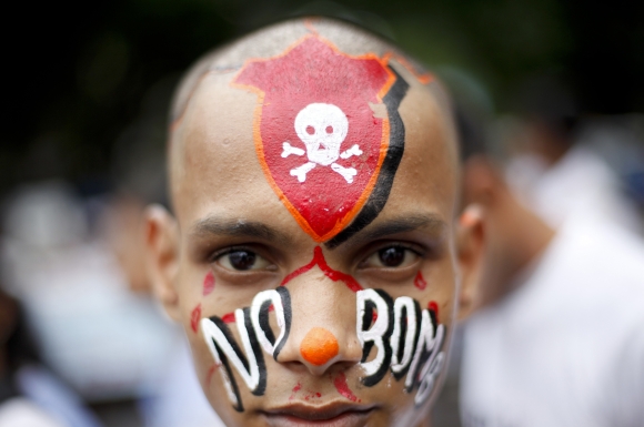 A student with a painted face participates in a peace rally in Mumbai
