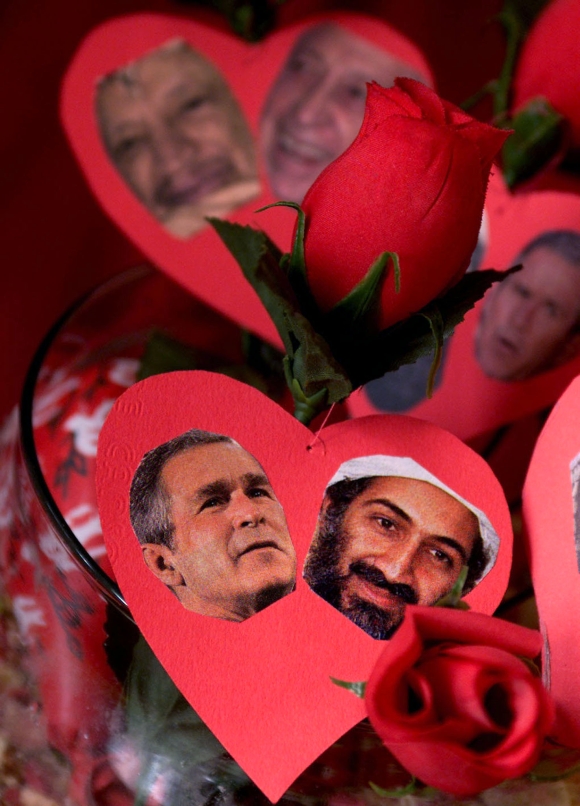 A bouquet of red roses shows pictures of George W Bush with Osama bin Laden in Amman