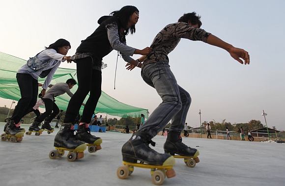 People rollerskate at a park in the city of Myitkyina in northern Myanmar.