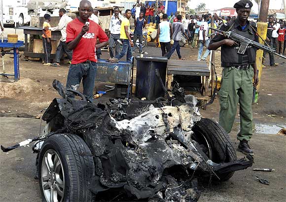 Part of a car used for detonating a bomb is seen at the scene of a blast, triggered by Boko Haram, in Nigeria's northern city of Kaduna