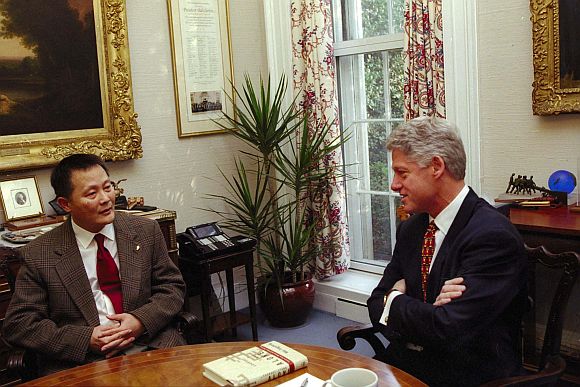 President Bill Clinton (Right) meets privately with Chinese dissident Wei Jingsheng, December 8 at the White House, in defiance of a Chinese appeal that US officials not meet him while he is in exile in America
