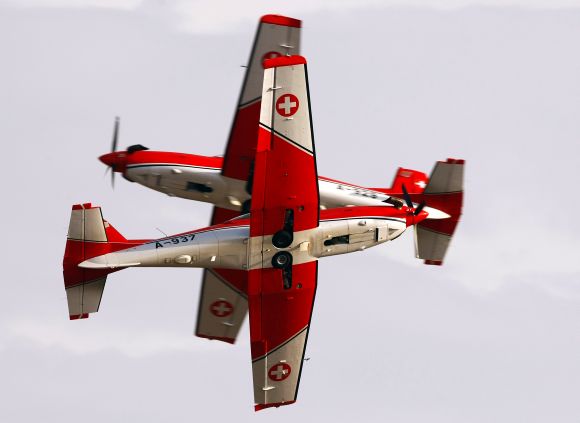 Two Pilatus PC-7 Turbo Trainer aircraft cross each other during the Malta airshow
