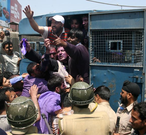 Police arrests some of the protesting J&K government employees, in Srinagar on Wednesday.