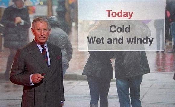 Prince Charles presents a special weather forecast during a visit to BBC Scotland's headquarters in Glasgow