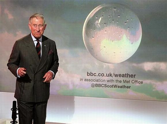 Prince Charles presents a special weather forecast during a visit to BBC Scotland's headquarters