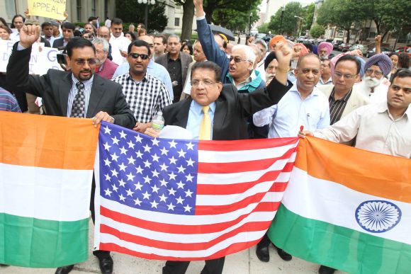 Members of the Indian American community with Indian tricolour, US flag and placards rally in support of Dharun Ravi, in New Jersey on Monday