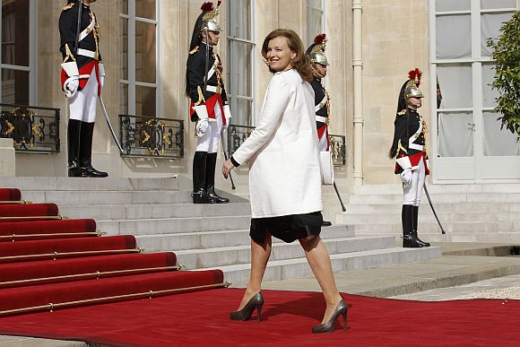 Valerie Trierweiler, companion of France's newly-elected President Francois Hollande, arrives on the red carpet in the courtyard of the Elysee Palace for the handover ceremony between Hollande and outgoing President Nicolas Sarkozy in Paris