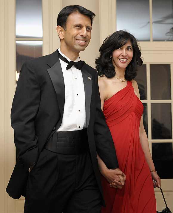 Jindal arrives with his wife for a dinner held for the National Governors Association by Obama at the White House
