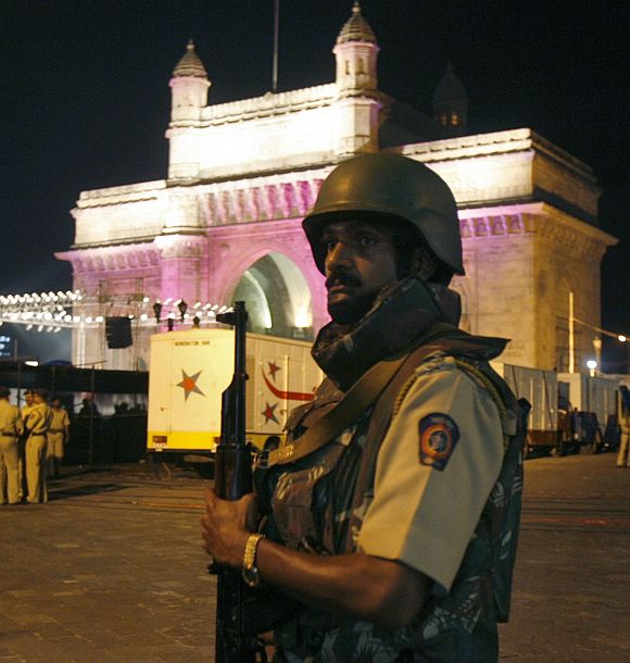 An armed policeman guards near the Gateway of India in Mumbai