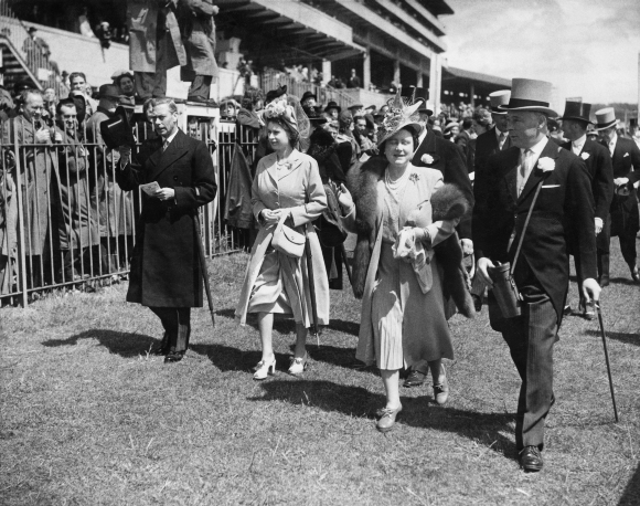 (From left to right) King George VI (1895 - 1952), Princess Elizabeth (later Queen Elizabeth II), Queen Elizabeth (later Queen Mother, 1900 - 2002) and Bernard Fitzalan-Howard, 16th Duke of Norfolk (1908 - 1945) at the Oaks Stakes, Epsom Downs Racecourse, Surrey. Photo taken on June 3, 1948.