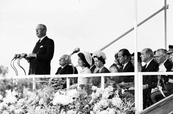 Former British prime minister Harold Macmillan (1894 - 1986) gives a speech at the inauguration ceremony of a memorial to John F Kennedy at Runnymede. Behind him on the stand are Jackie Kennedy, Queen Elizabeth II, Prince Philip, and prime minister Harold Wilson (1916 - 1995, far right). Photo taken on May 14, 1965