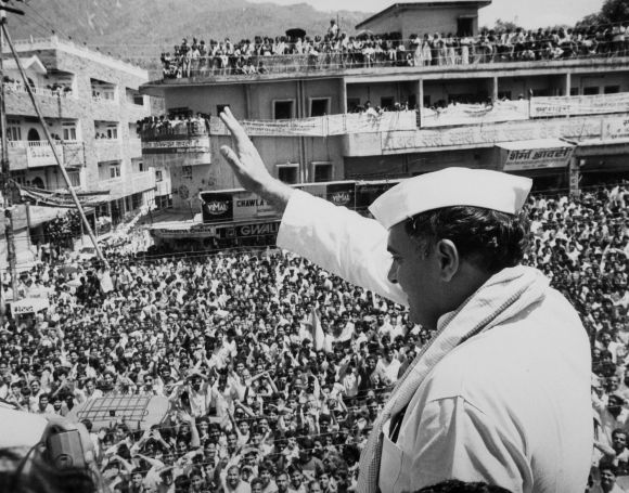 Archival image shows Rajiv Gandhi waving to the crowd during a campaign rally in Rishikesh