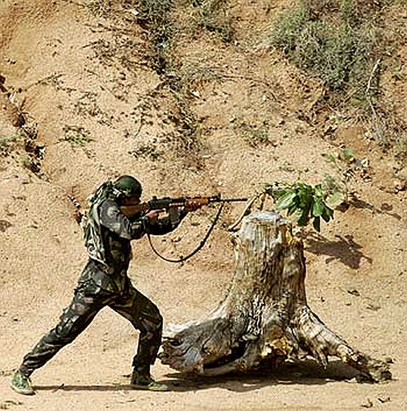 A paramilitary trooper trains at the Jungle Warfare School in Kanker village, Chhattisgarh