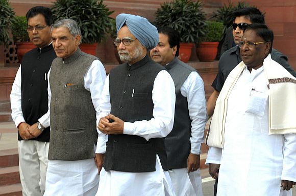 Prime Minister Manmohan Singh arrives at the Parliament House to attend the Budget Session, in New Delhi