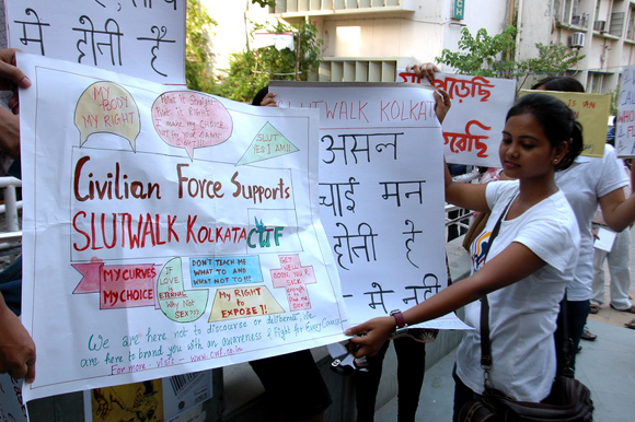 Teenagers carry posters with slogans against sexual violence in Kolkata