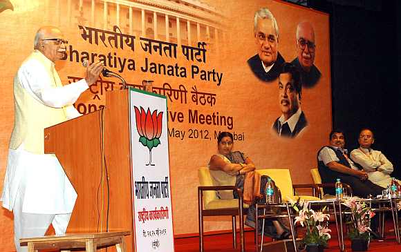 Senior BJP leader L K Advani delivers a speech at Mumbai's Y B Chavan Auditorium as Sushma Swaraj, Nitin Gadkari and Arun Jaitley listen intently