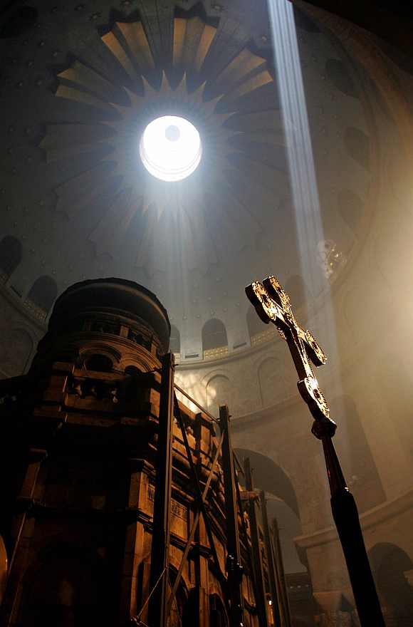 A ray of light descends from the dome of the Church of the Holy Sepulcher before the Holy Fire ceremony in Jerusalem. The Holy Fire ceremony is part of Orthodox Easter and the flame symbolizes the resurrection of Christ