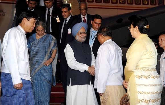 Dr Manmohan Singh and his wife Gursharan Kaur being received by the Minister of Foreign Affairs of Myanmar U Wunna Maung Lwin on their arrival at Nay Pyi Taw International Airport, Myanmar