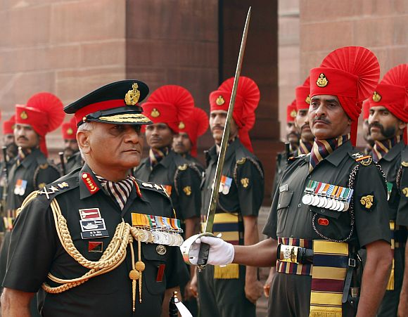 Army Chief General V K Singh inspects the guard of honour after taking over the charge, in New Delhi