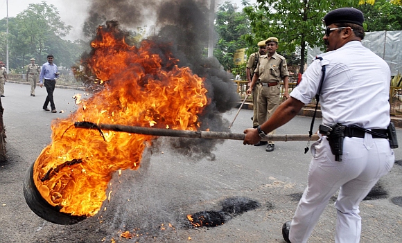 Bandh supporters burning tyres in front of Assam Secretariat in Guwahati on Thursday during the twelve-hour
