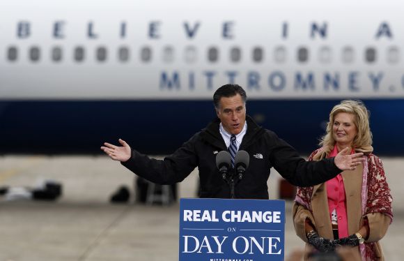 Mitt Romney and his wife Ann arrive at a campaign rally in Newington, New Hampshire, on Saturday
