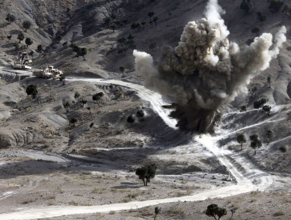 US soldiers blows up a roadside bomb set up by Taliban fighters near the town of Walli Was in Paktika province, near the border with Pakistan