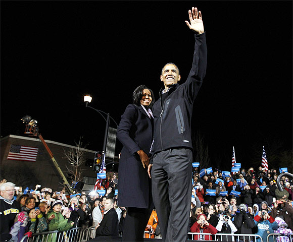 US President Barack Obama with First Lady Michelle Obama during his final presidential campaign rally in Des Moines, Iowa
