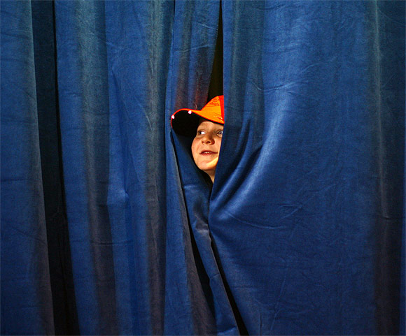 Republican vice presidential candidate Paul Ryan's son Sam looks out from behind the backstage curtains