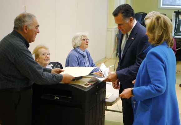 Republican presidential nominee Romney, with his wife Ann at his side, casts his ballot in Belmont