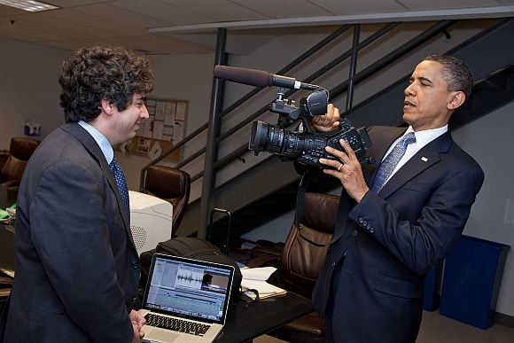 US President Barack Obama jokingly pretends to tape Chaudhary backstage before a town hall meeting at ElectraTherm, Inc in Reno, Nevada