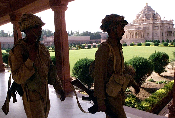 Border Security Force personnel patrol the Akshardham temple complex after commandos flushed out gunmen from inside in Gandhinagar, on September 25, 2002
