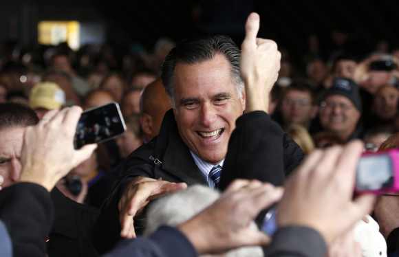 US Republican presidential nominee and former Massachusetts Governor Mitt Romney greets supporters at a campaign rally in Dubuque, Iowa